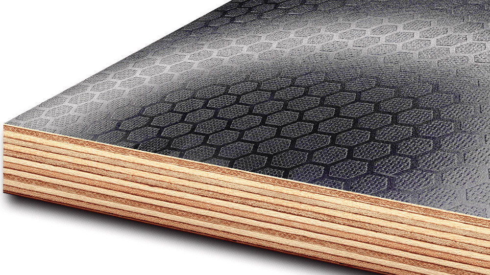 ROCPLEX hexa grip plywood phenolic film faced waterproof plywood panel with hexagonal mesh anti slip surface R12 slip resistance edge sealed birch core and heavy duty industrial flooring application for trailers trucks marine decks scaffolding formwork and stage platforms produced by global plywood supplier.