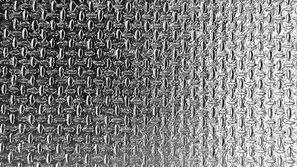 ROCPLEX Mesh Antislip Plywood For Trailers; heavy-duty waterproof phenolic film faced plywood with mesh-pattern anti-slip surface; sealed edge slip resistant trailer flooring panels; durable plywood boards for trucks, containers, and transport decks from ROCPLEX.